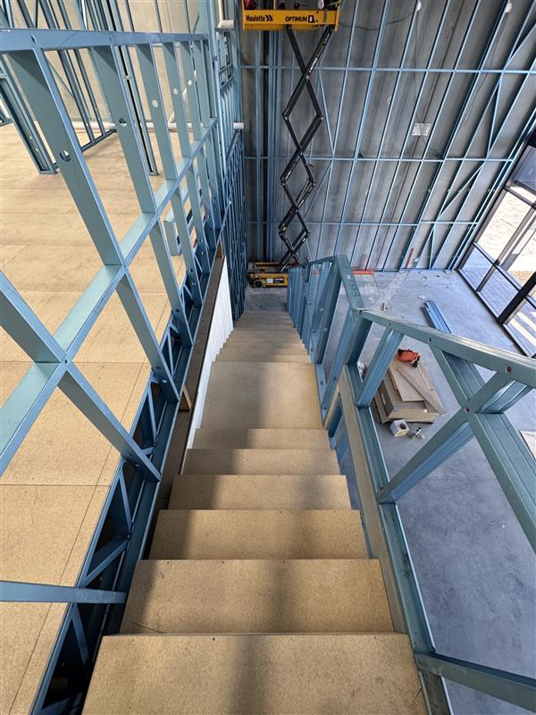 Steel frame and stair void inside a residential build