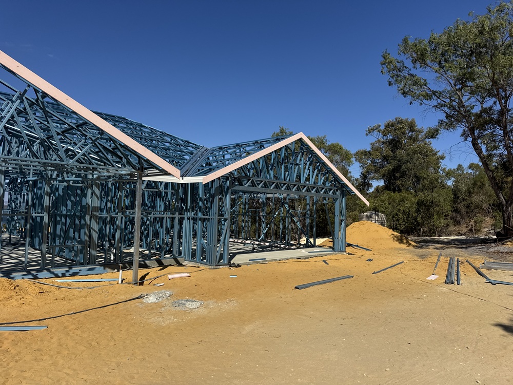 Steel wall frame and roof trusses at a house build