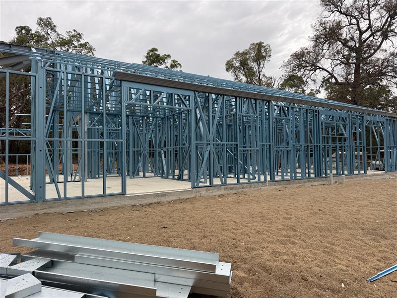 Long steel wall frame run on a rural block